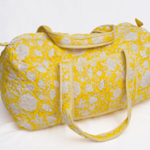 Maleta acolchada amarilla con estampado floral blanco y asas largas reforzadas